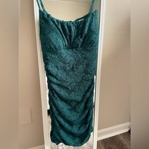 An emerald green maxi bodycon dress from Windsor. Worn once, no damage or tears.